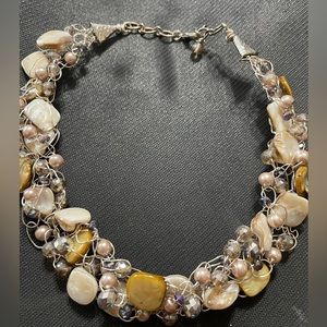 Beautiful statement necklace . This necklace has a pearls and beads.